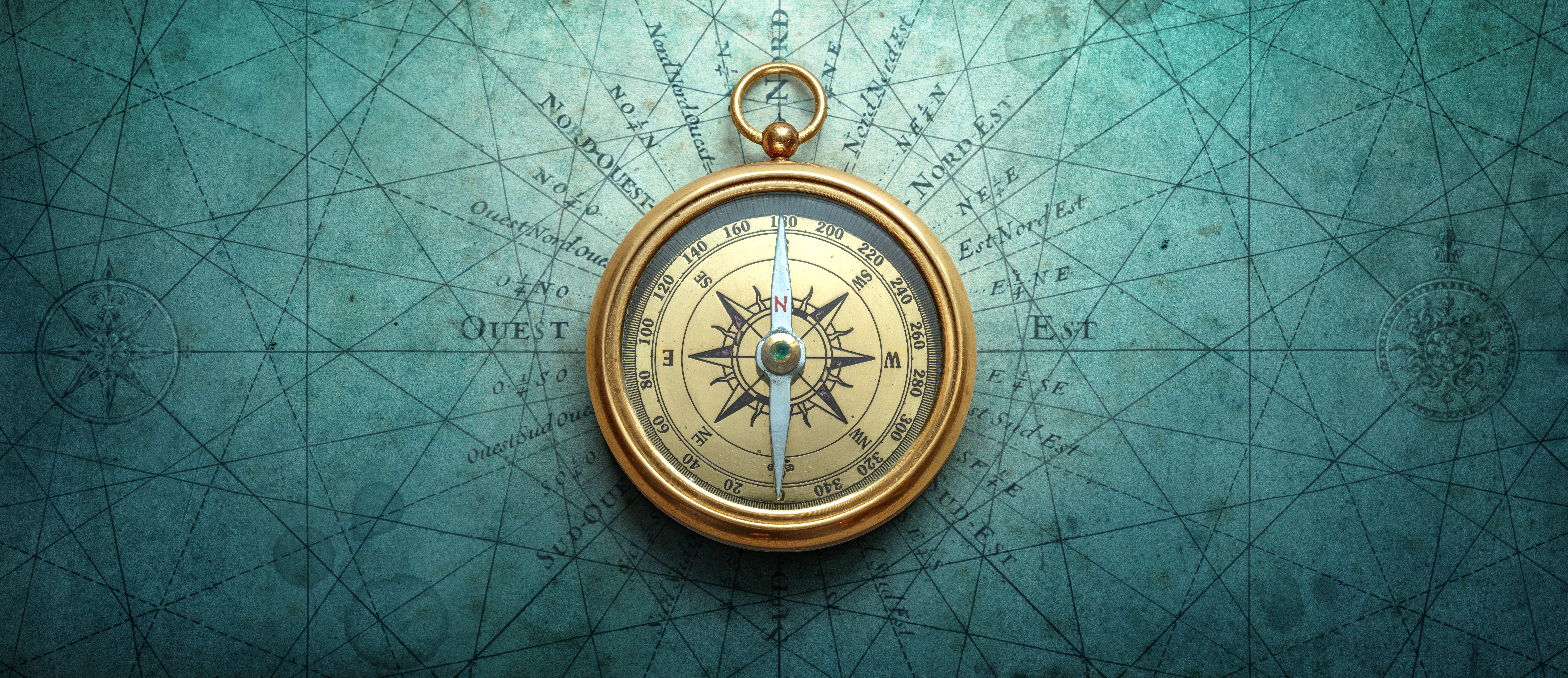 Antique-style compass rose over a faint nautical chart, representing GEO as a guide